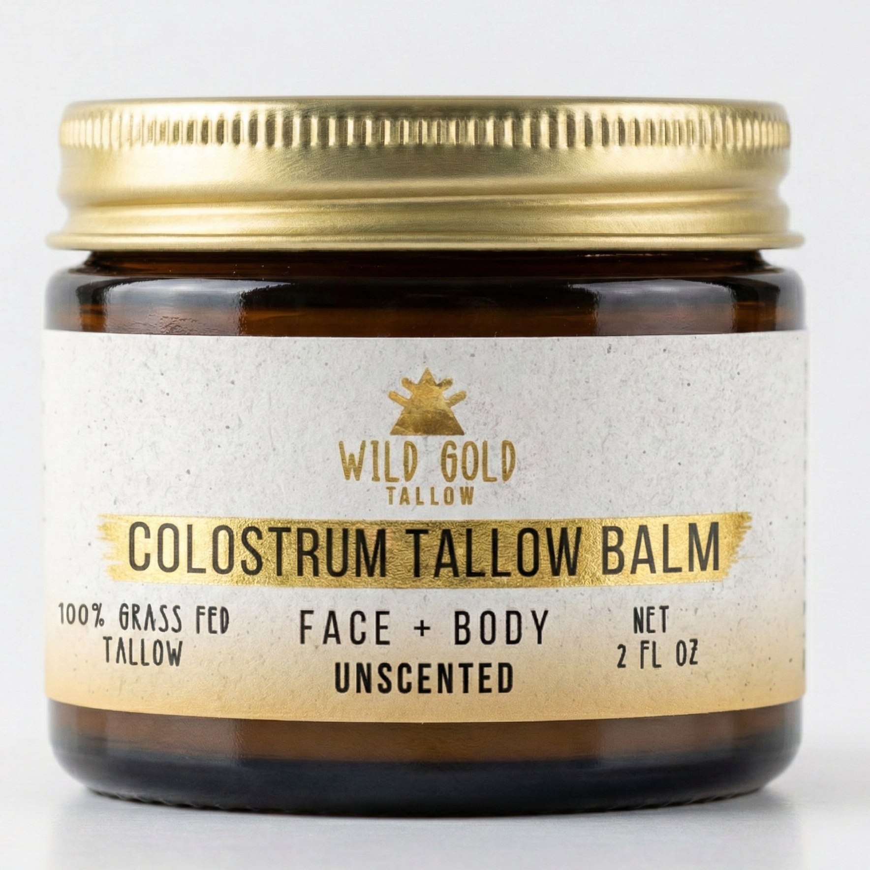 Jar of Wild Gold Tallow Colostrum Tallow Balm on a white background